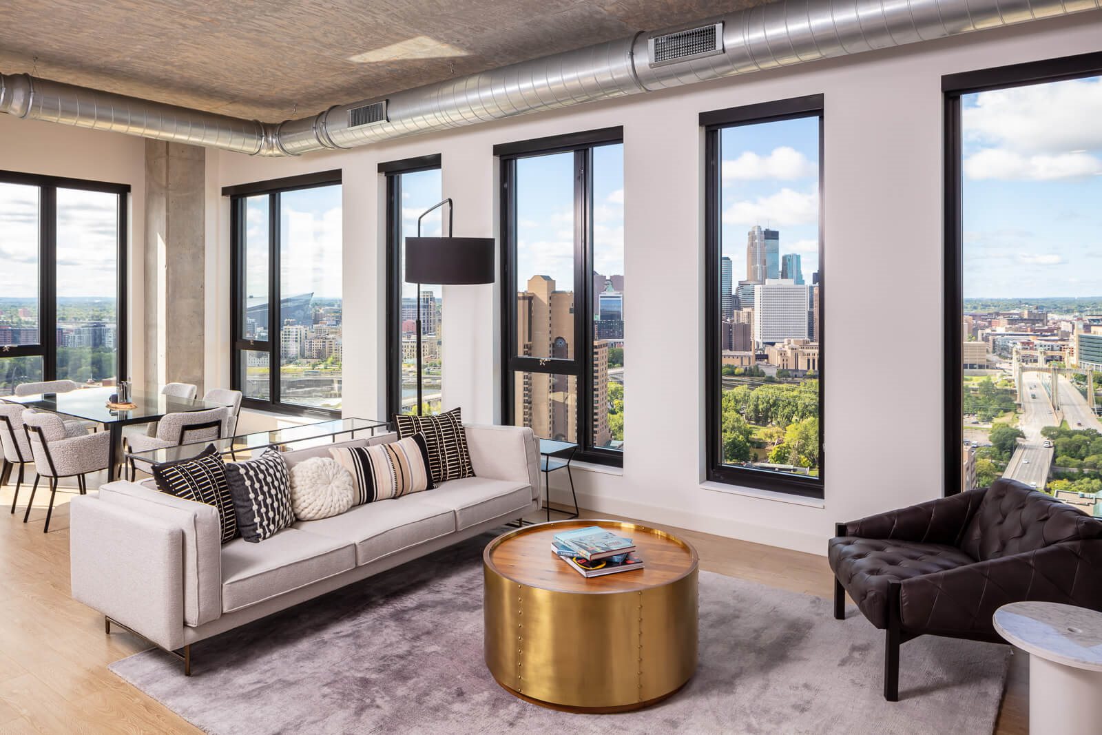 Penthouse living and dining room with view of downtown minneapolis